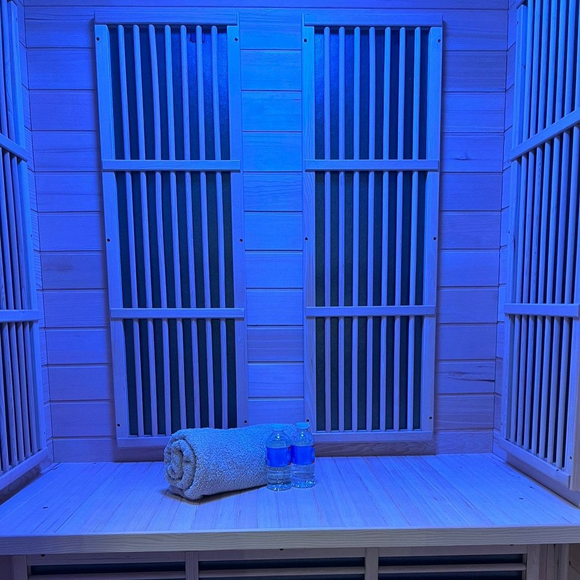 A towel is sitting on a wooden table in a sauna.