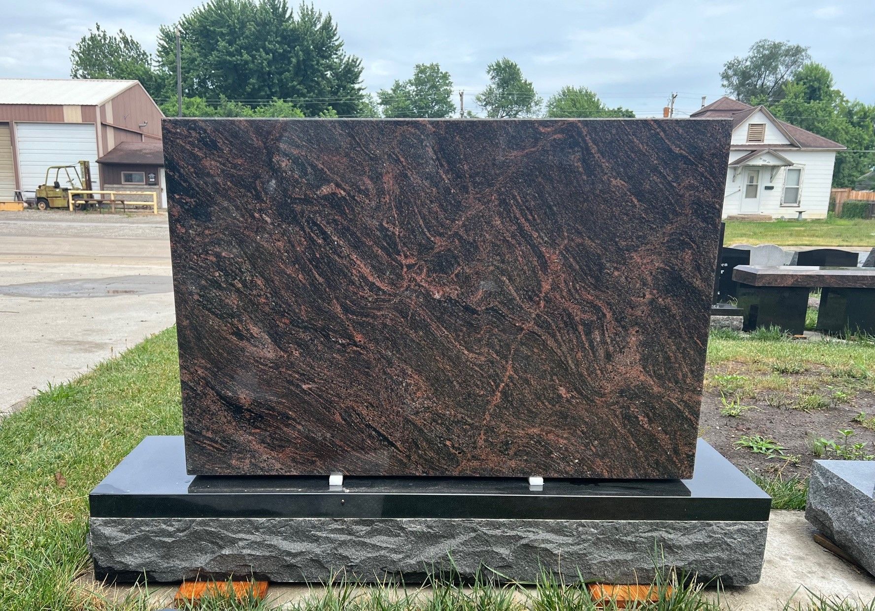 A gravestone with the letter t on it