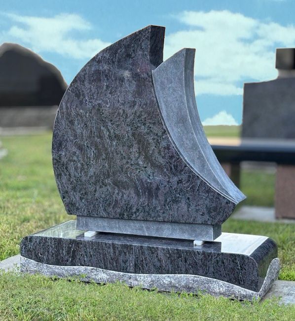 Tombstone With Angel Hugging Heart — Ottumwa, IA — Fuller Monument