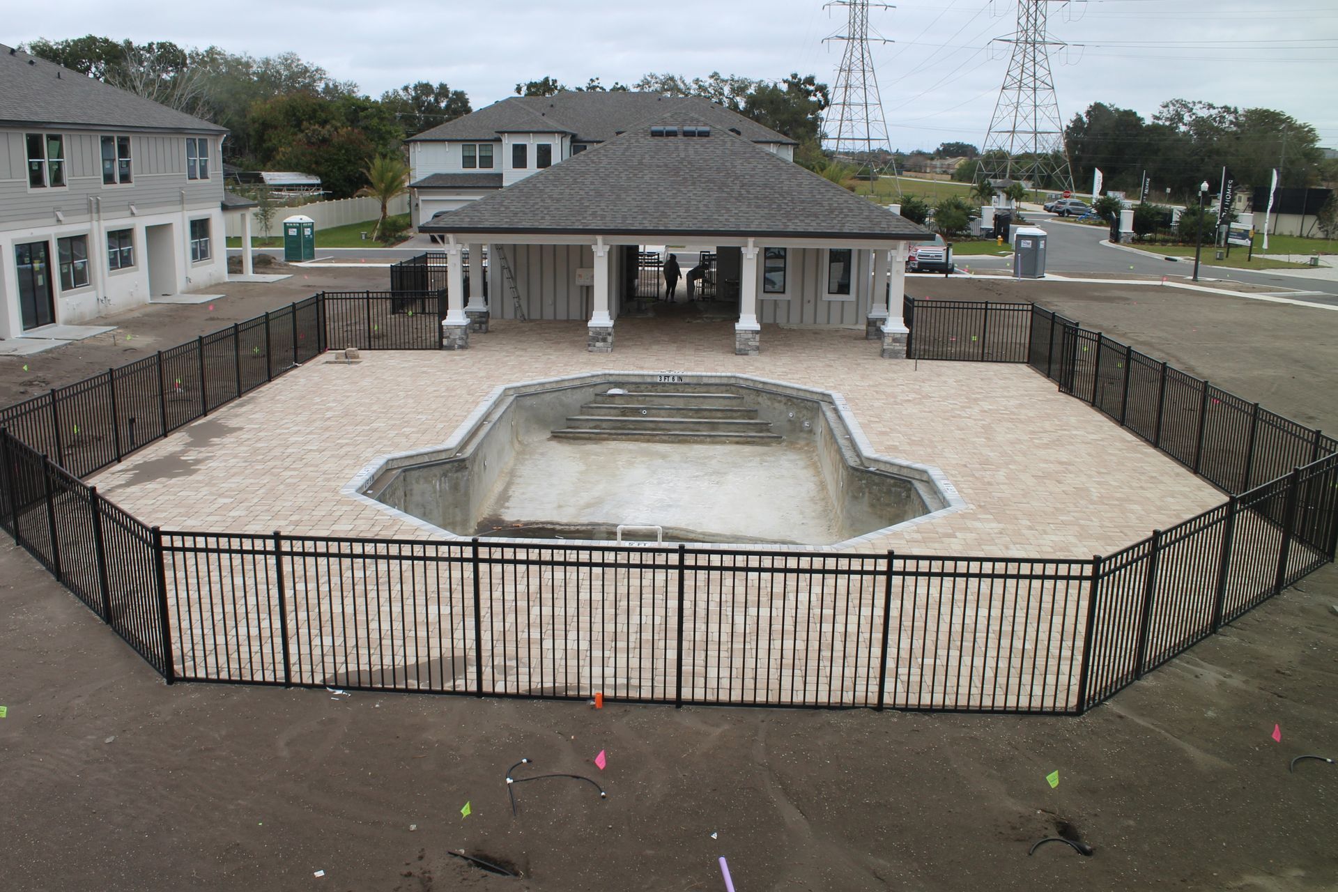 Commercial aluminum fence installation around an apartment complex's pool in Tampa, FL