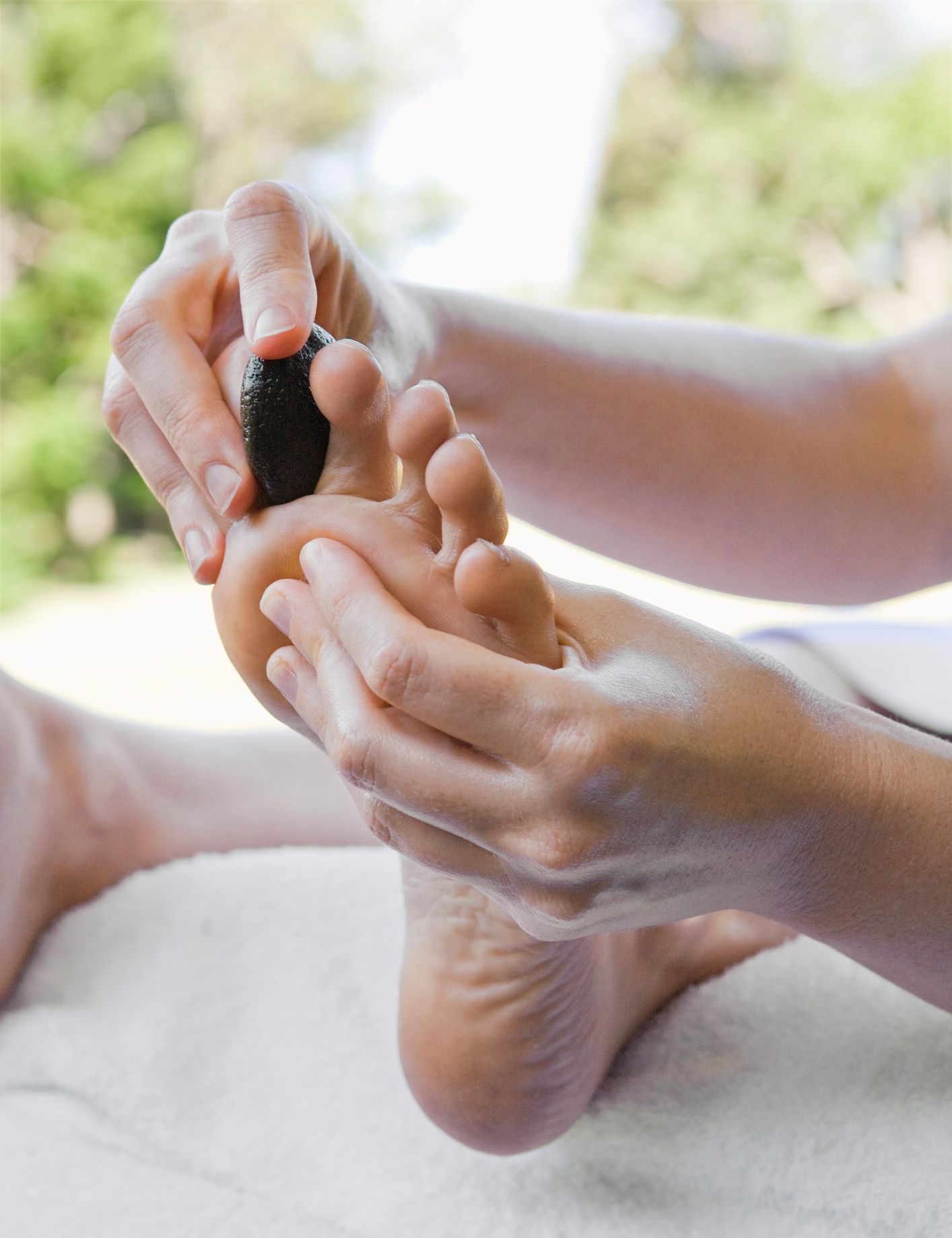 A pregnant woman is getting a massage from a man.