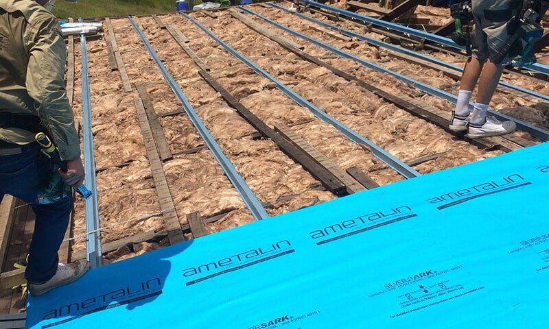 Insulation batts installed on re-roof with extra heavy duty sarking