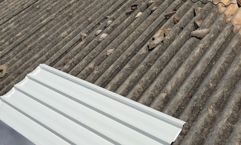 Old damaged asbestos roof