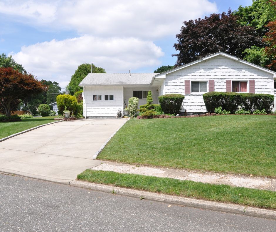 Front yeard of a house with a healthy lawn