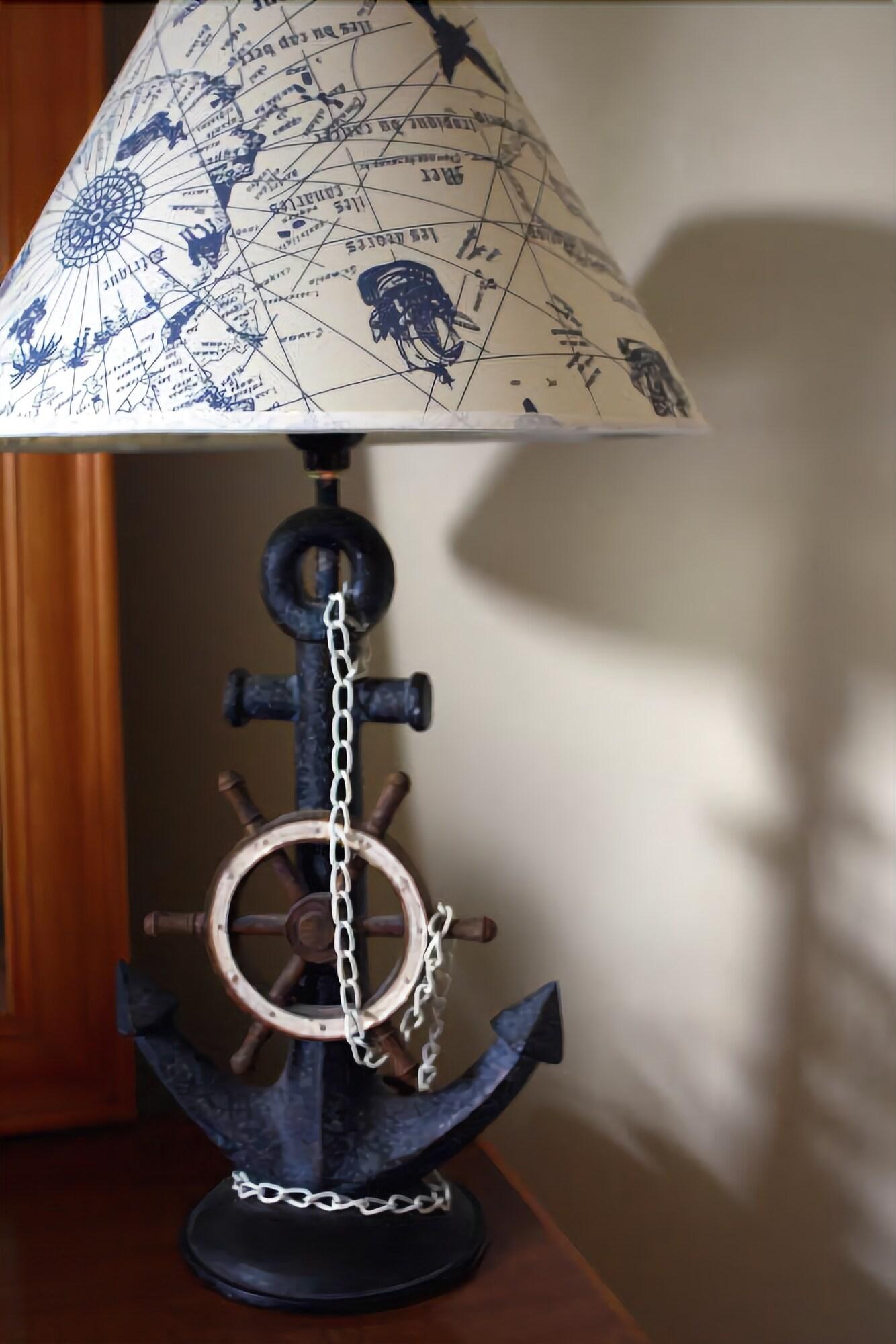 A lamp with an anchor and a steering wheel on it