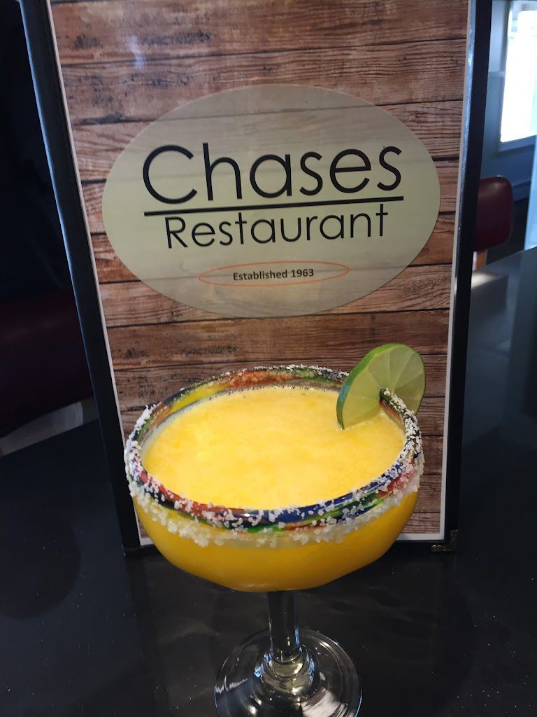 A margarita in front of a menu for chases restaurant