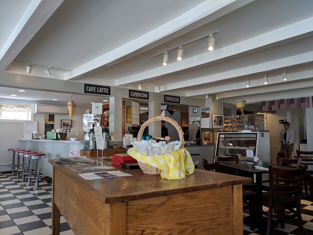 A wooden table in a restaurant with a basket on it