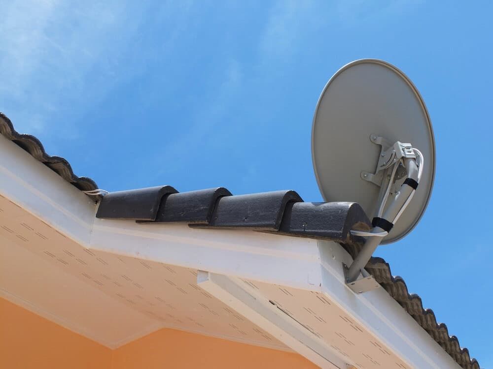 A Satellite Dish Is Mounted On The Roof Of A House — Coastwide Antennas In Ourimbah, NSW