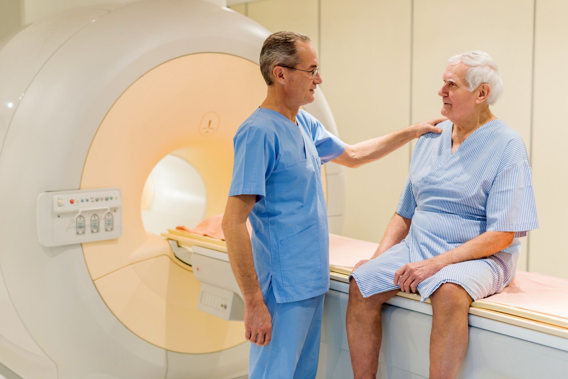 Smiling mature radiologist and senior patient talking to each other — New Hartford, NY — Oxford Medical Imaging