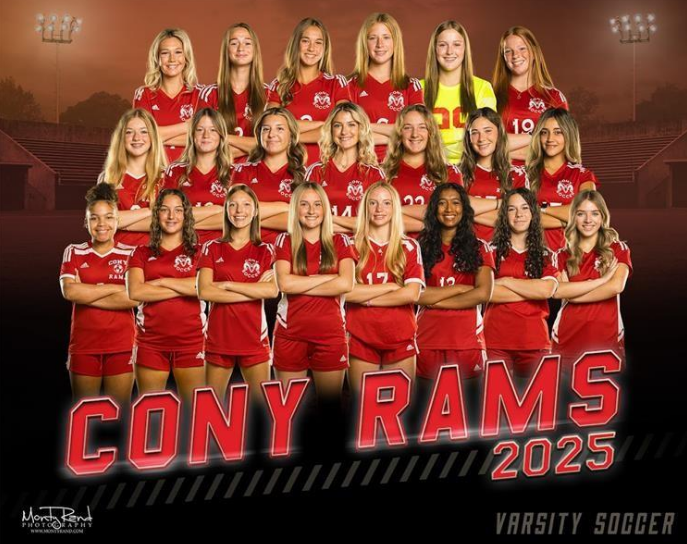 Coney Rams 2025 varsity soccer team photo. Players in red uniforms stand in rows on a field.