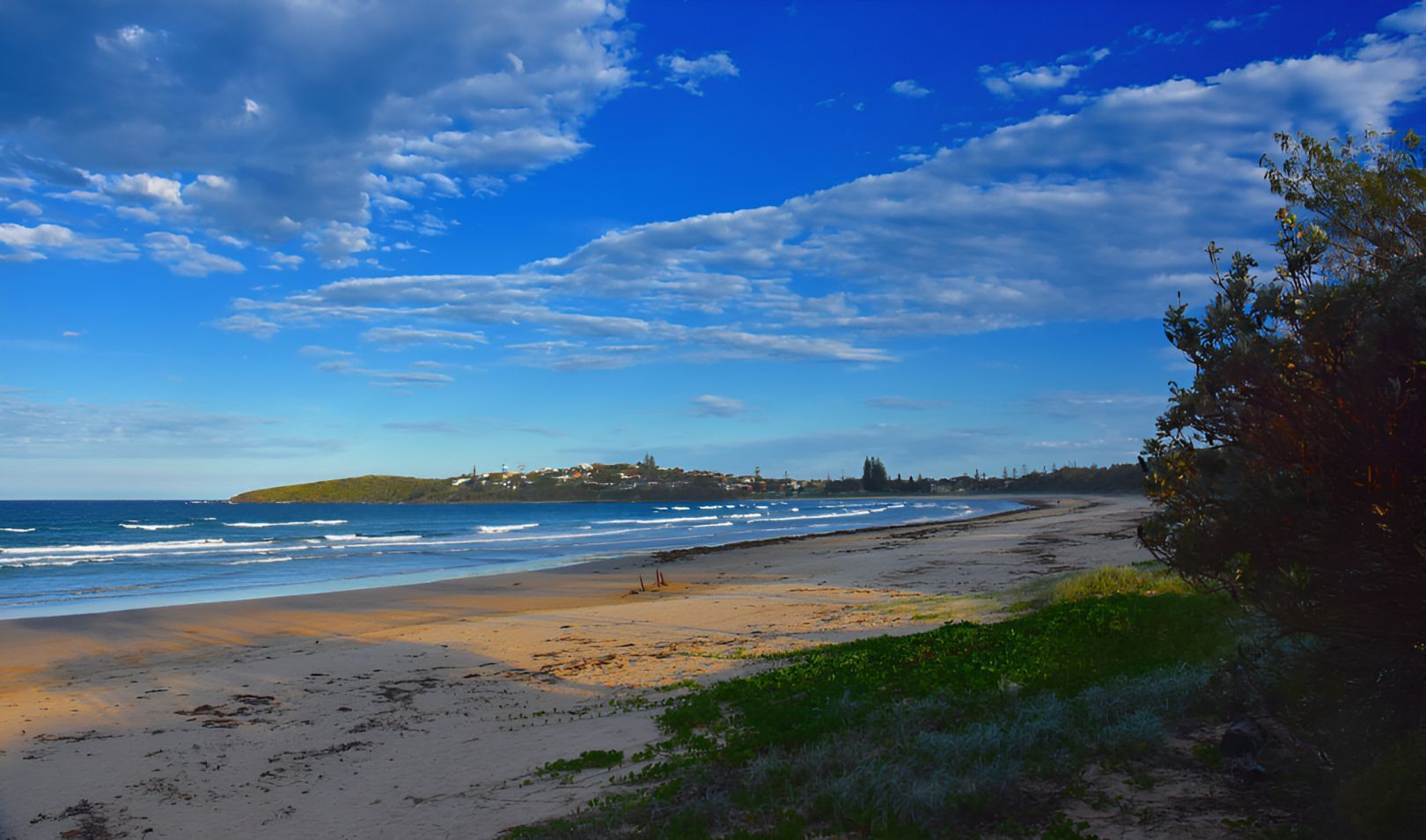 A Painting Of A Beach With A Blue Sky And Clouds — Blue & White Veterinary Clinic In Woolgoolga, NSW