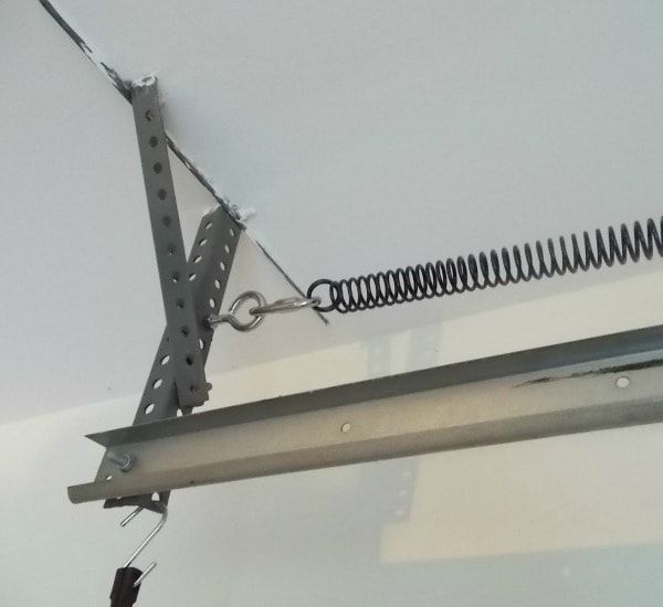 A garage door with a spring attached to it