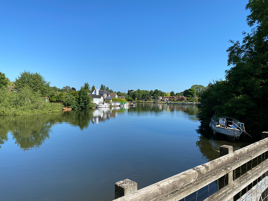 The river at Penton Hook surrounded by trees.