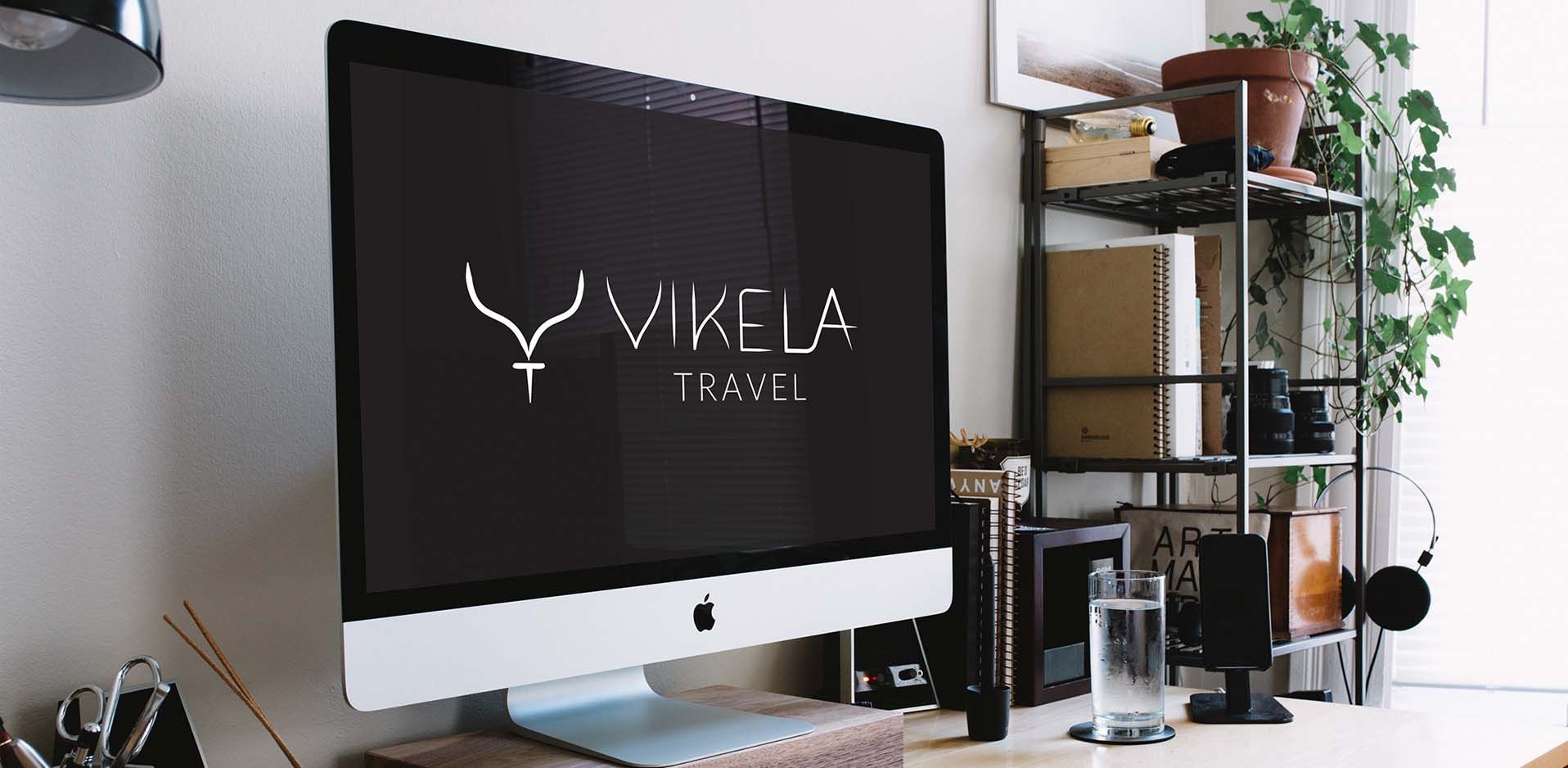 Vikela logo displayed on an iMac screen in an office