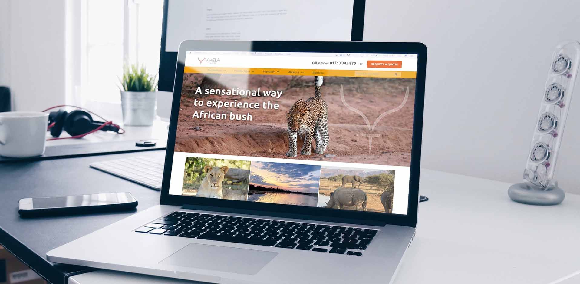 Open laptop with Vikela website home page