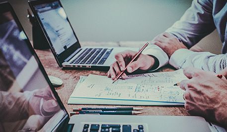 Laptops on tables, web design process