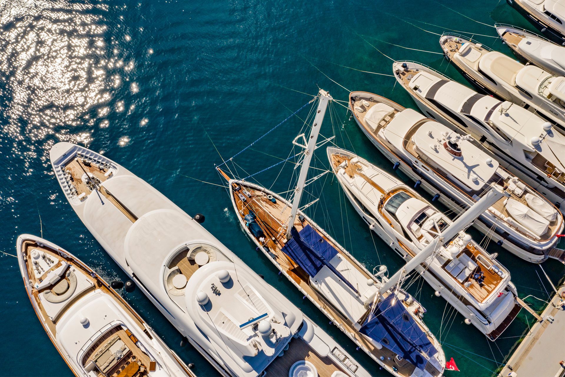 Aerial view of docked yachts in a harbor
