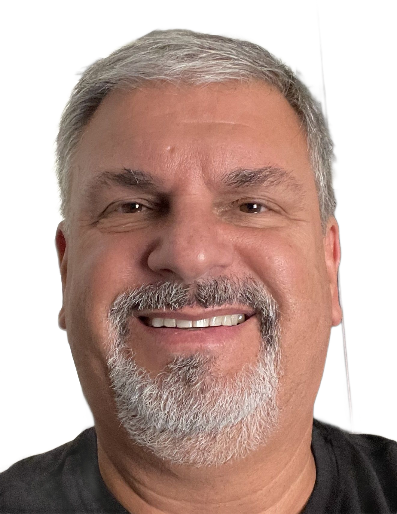 A man in a suit and tie is smiling for the camera.