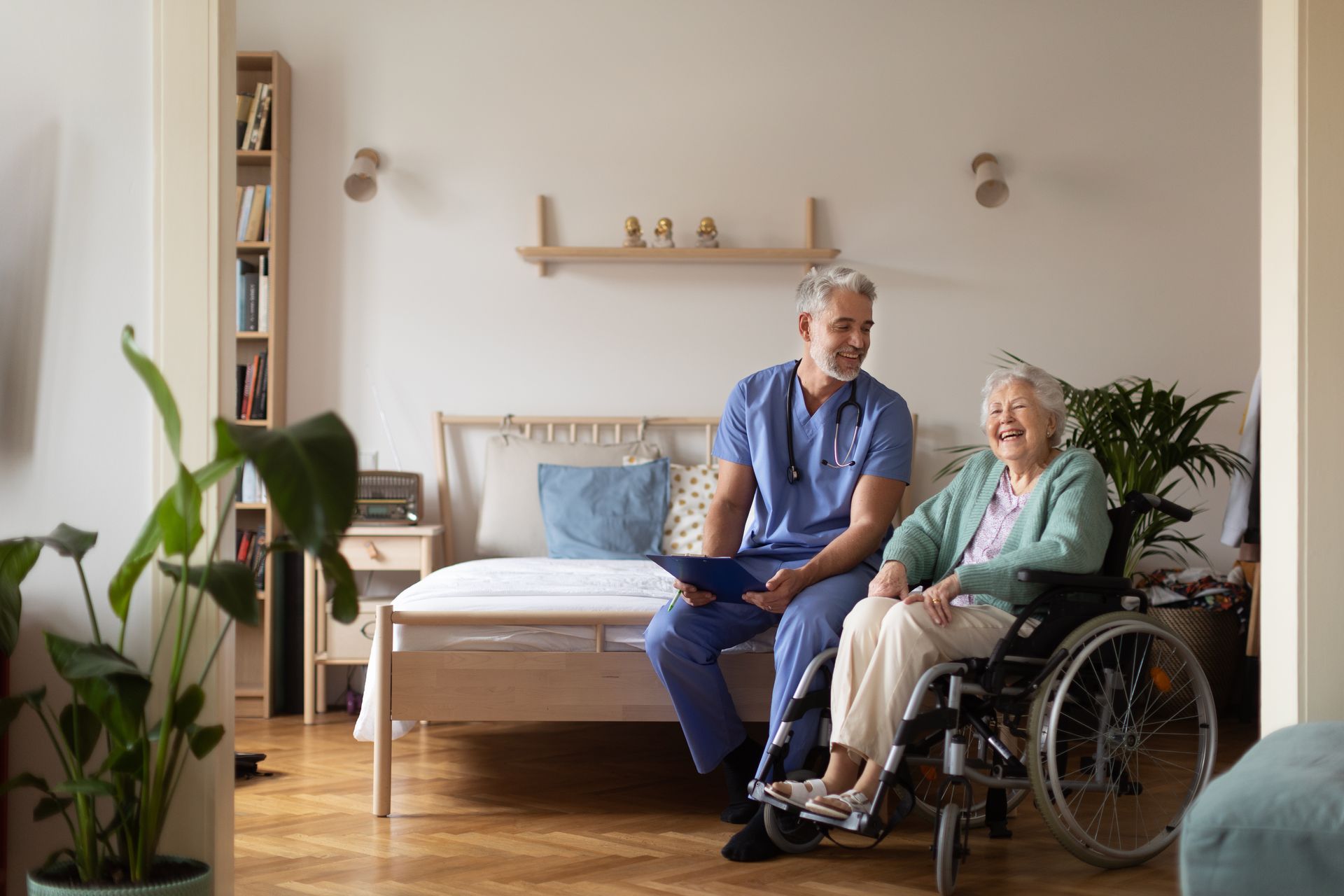 Caregiver doing regular check-up of senior woman in her home.