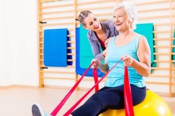 Grandmother Stretching — Pain Management in Cherry Hill, NJ