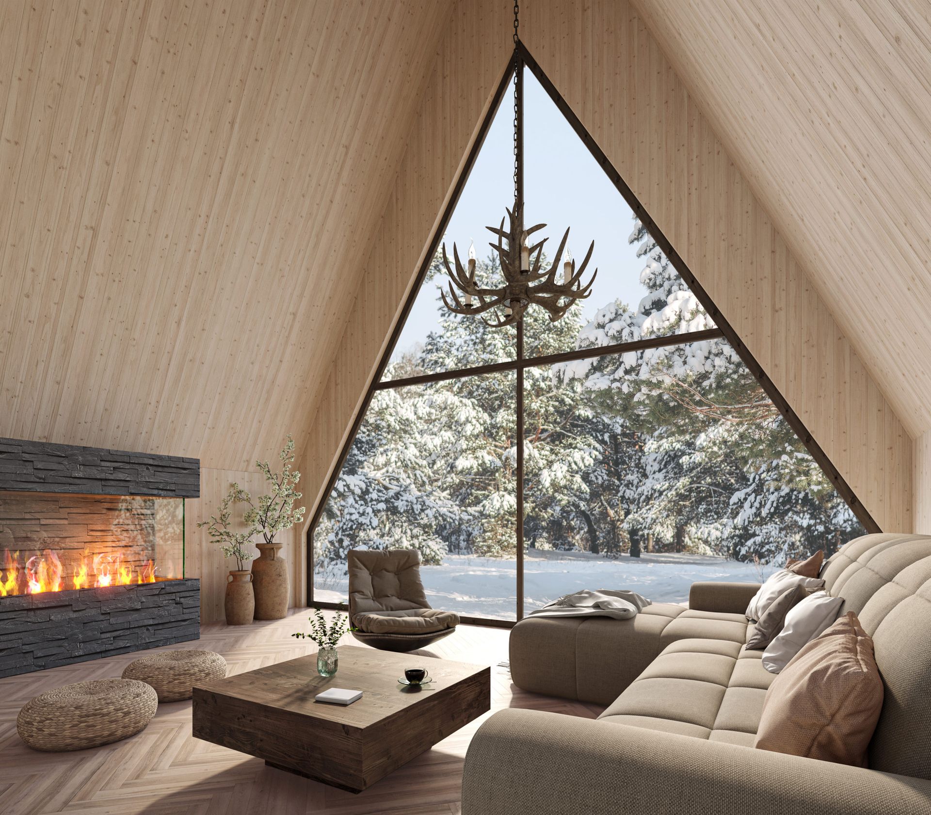 Cozy A-frame cabin living room with light wood walls, a stone fireplace, large triangular window, and snowy forest view. Holmen Husky Lodge, Alta