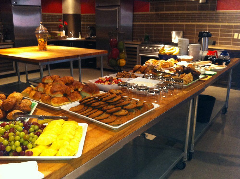 A buffet table with a variety of food on it