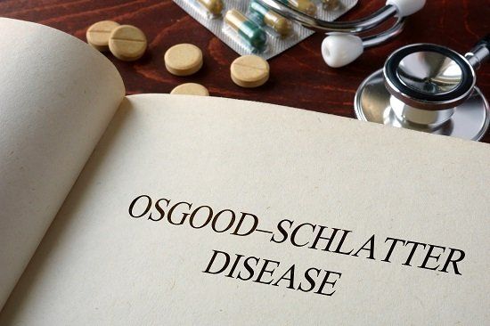 A textbook opened to a page containing the title Osgood Schlatter Disease