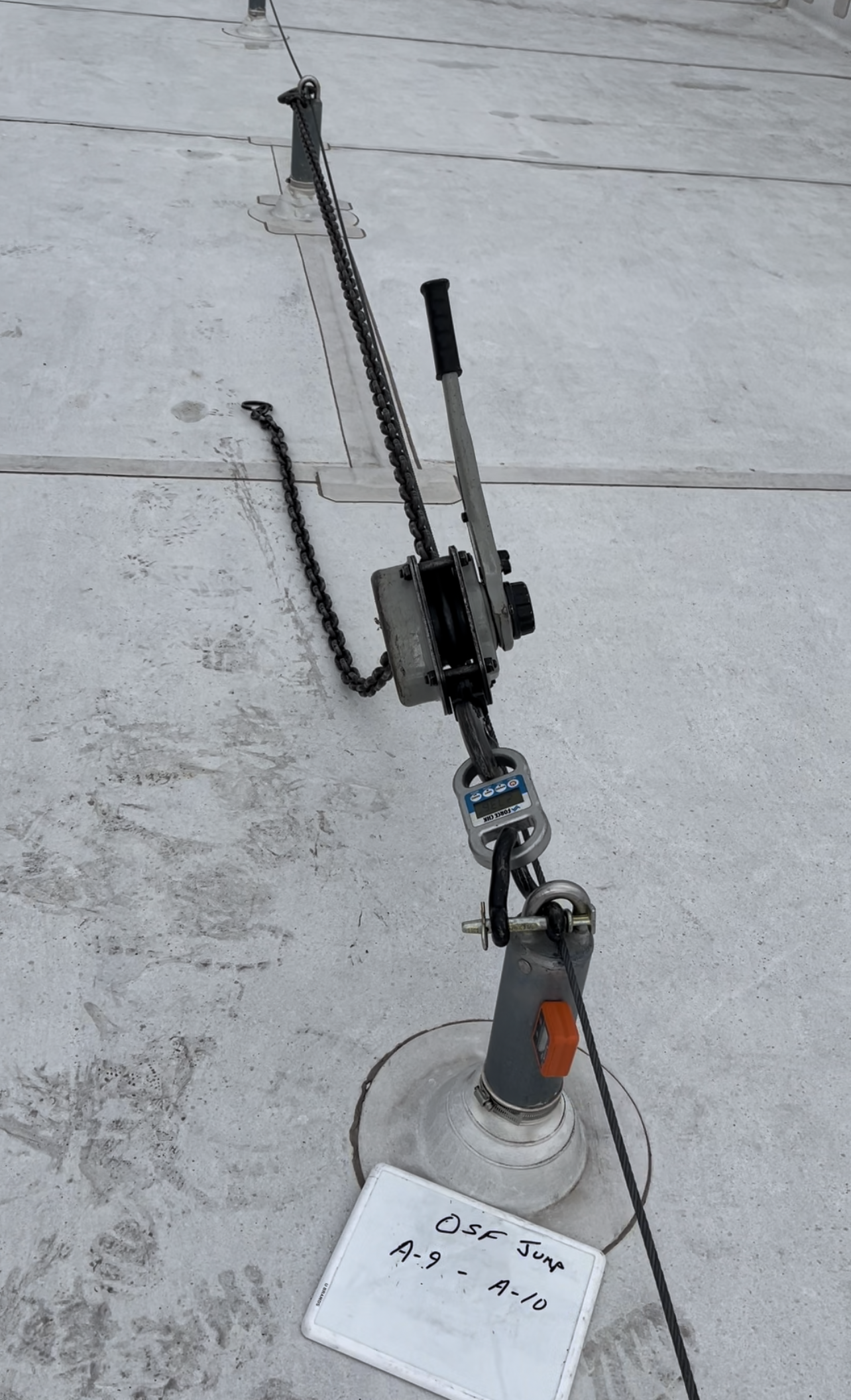 A piece of equipment is sitting on top of a concrete surface.