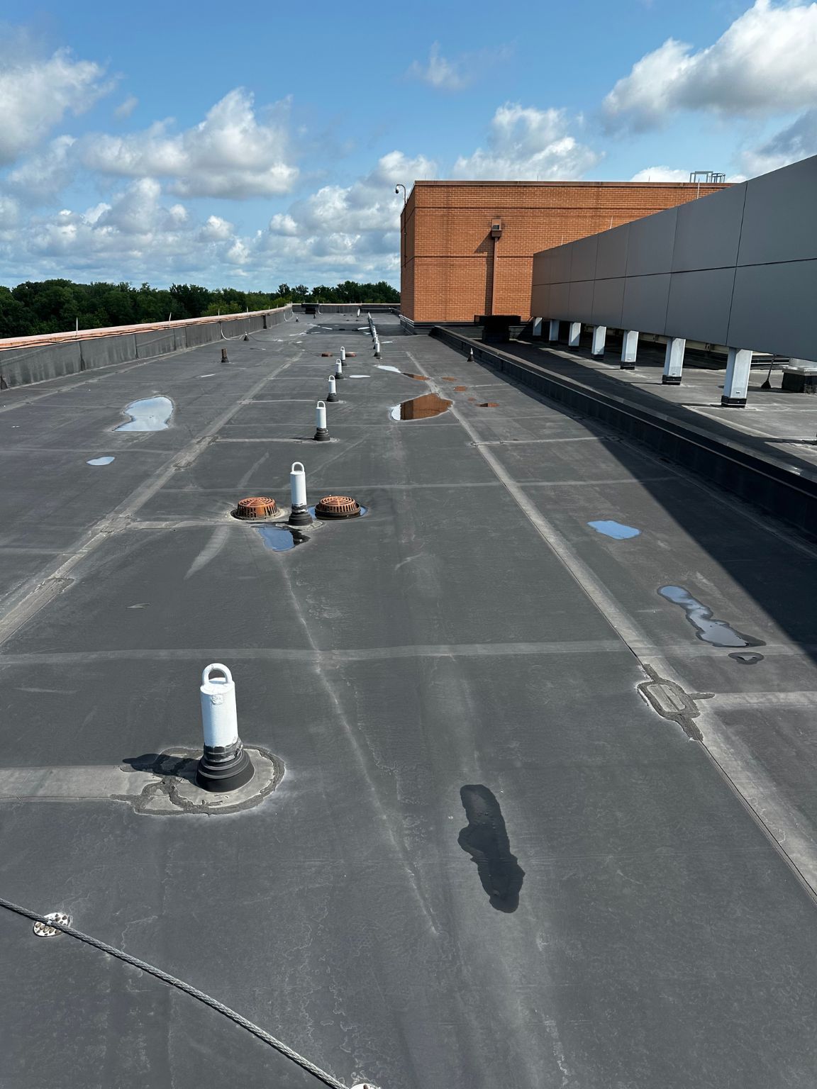 The roof of a building has a lot of holes in it