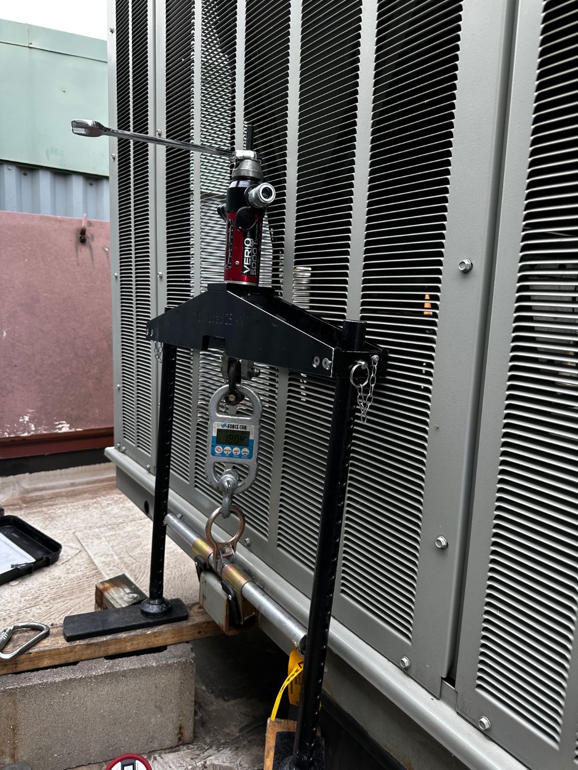 A machine with a digital scale attached to it