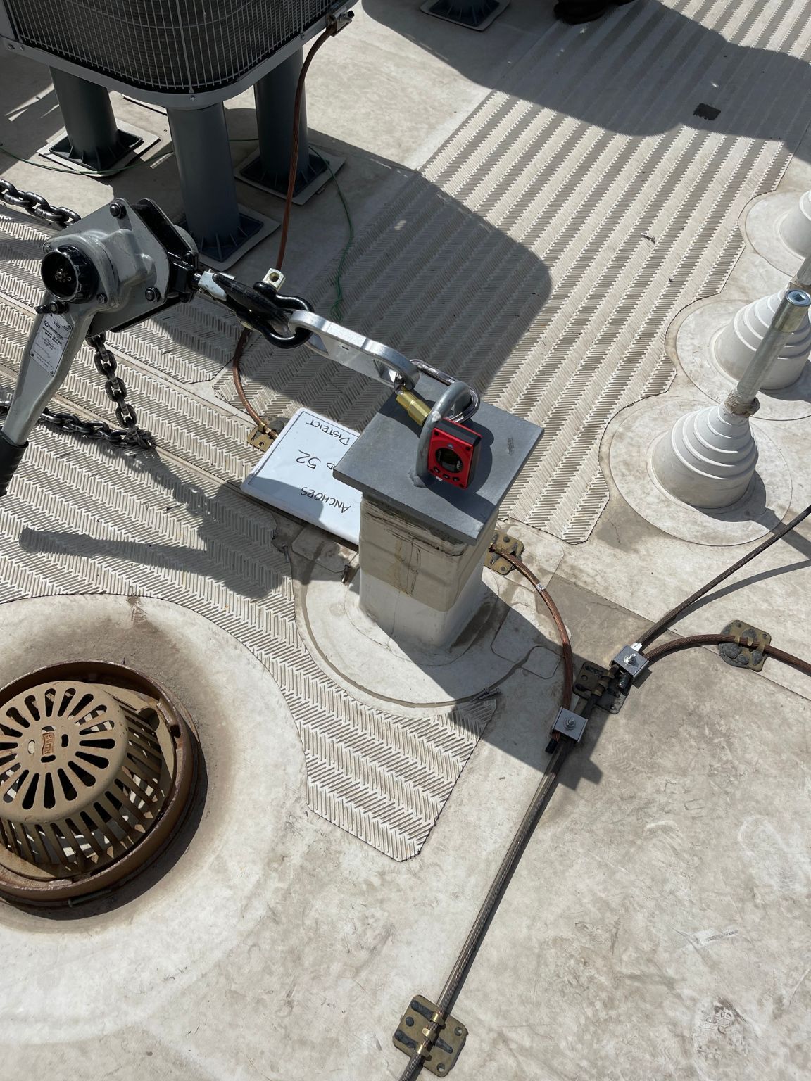 An aerial view of a roof with a red padlock on top of it