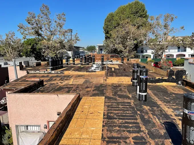 Flat roof installation showcasing the benefits of torch-down roofing for waterproof protection.