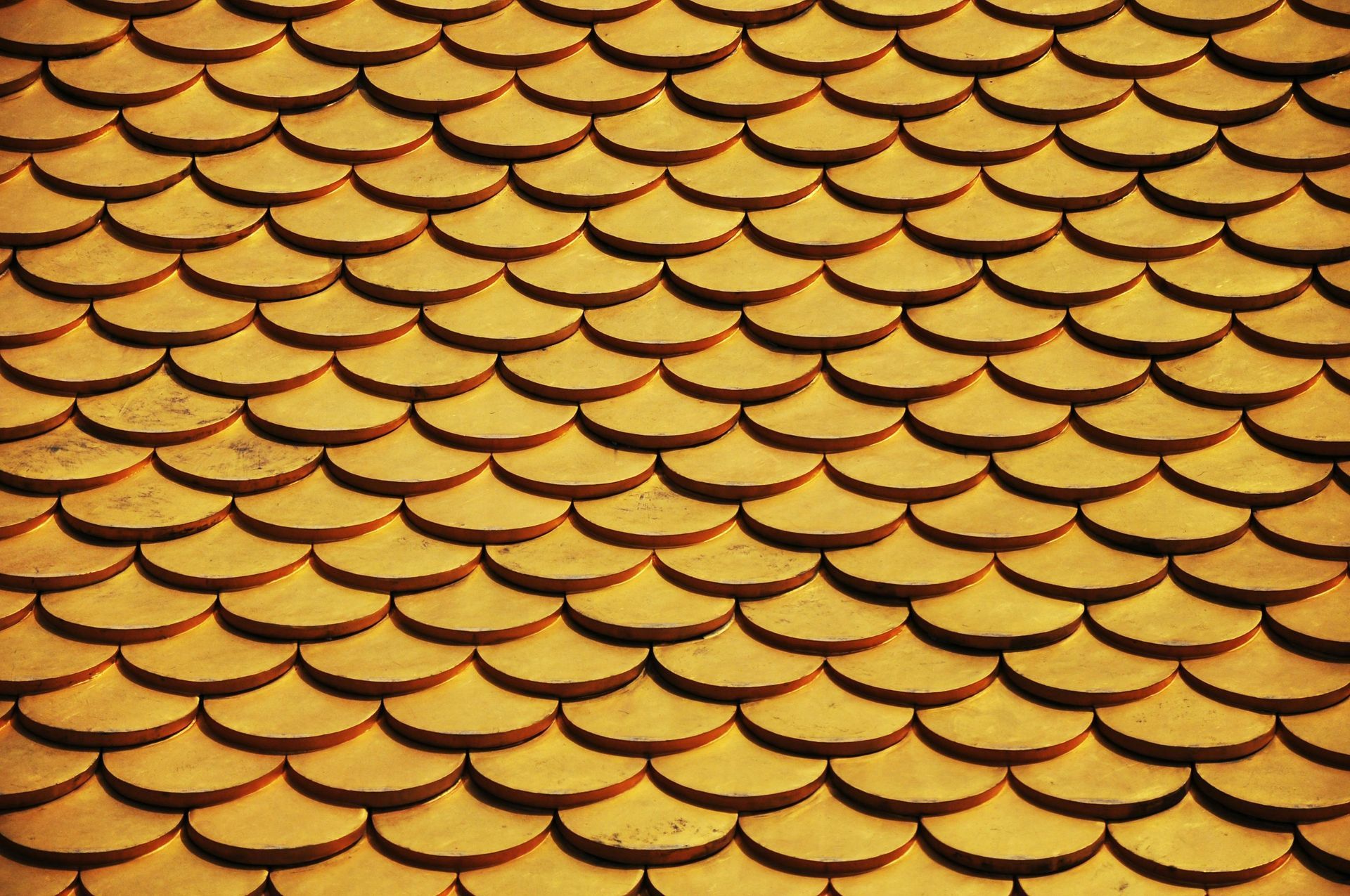 Golden, scale-patterned roof tiles.