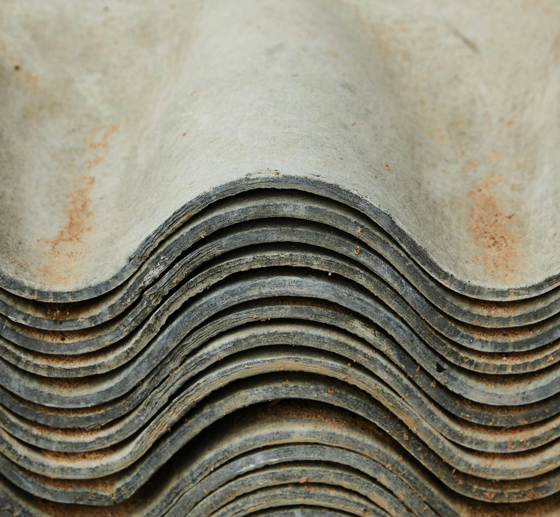 A close up of a stack of roof tiles