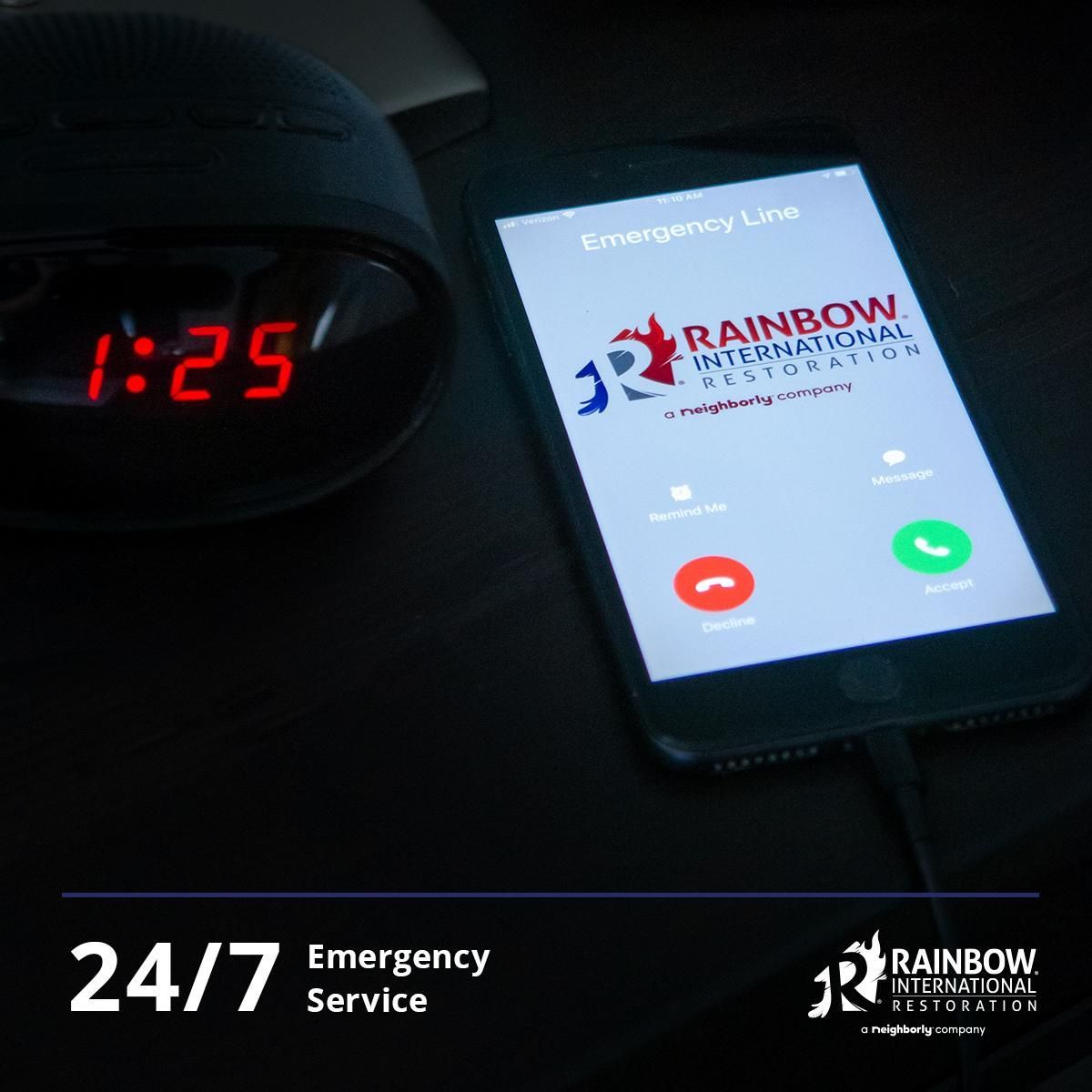 A man is talking on a cell phone while sitting on a couch.