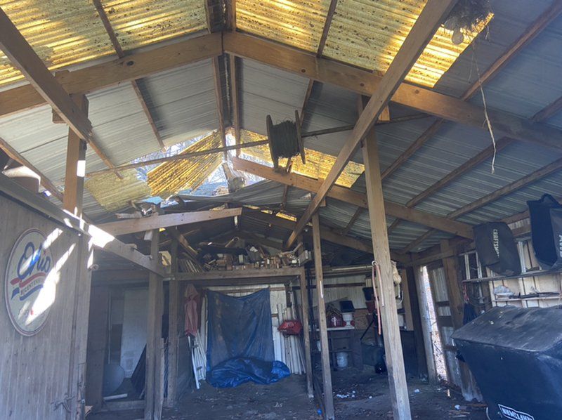 The inside of a building with a roof that is covered in plastic.