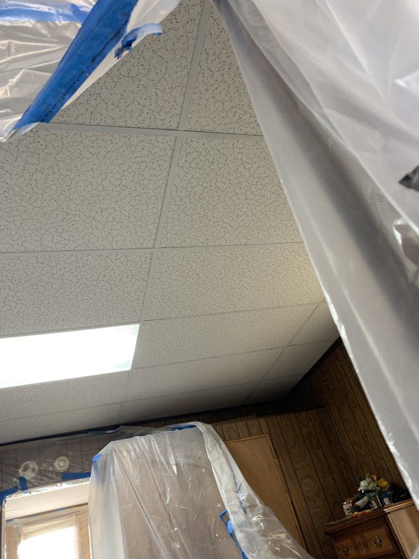 A room with a ceiling that is covered in plastic.