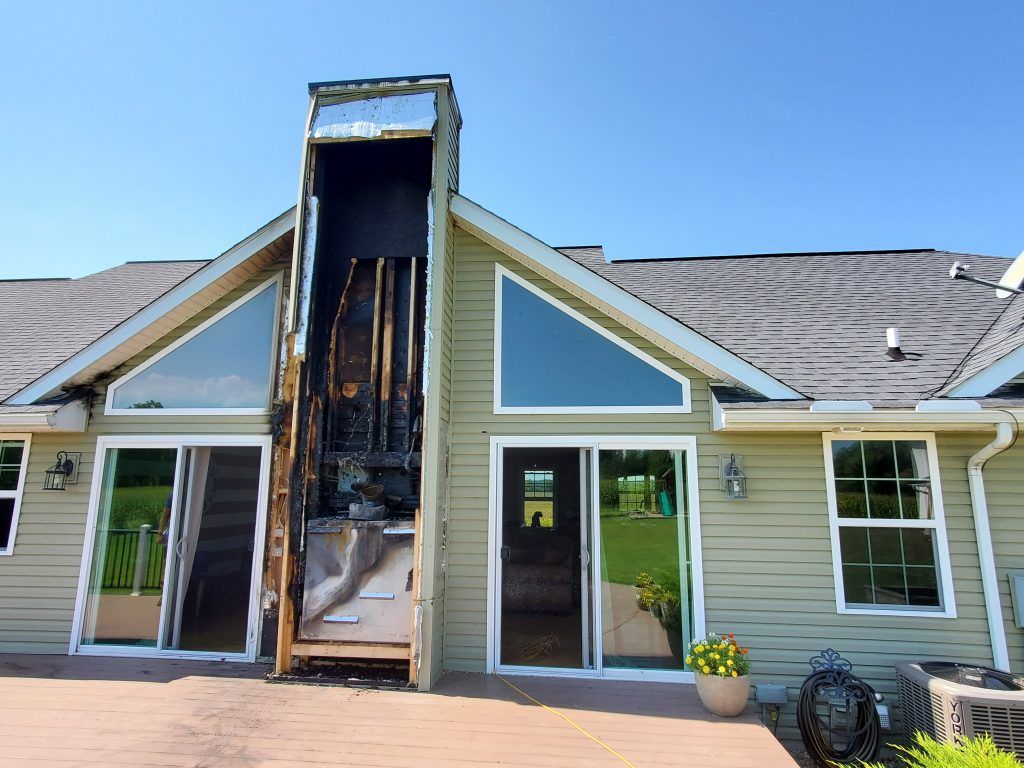 A house with damage from a chimney fire. 