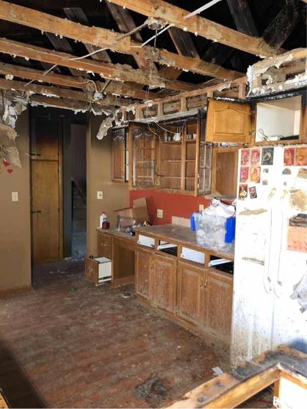 A kitchen in a house that is being remodeled.