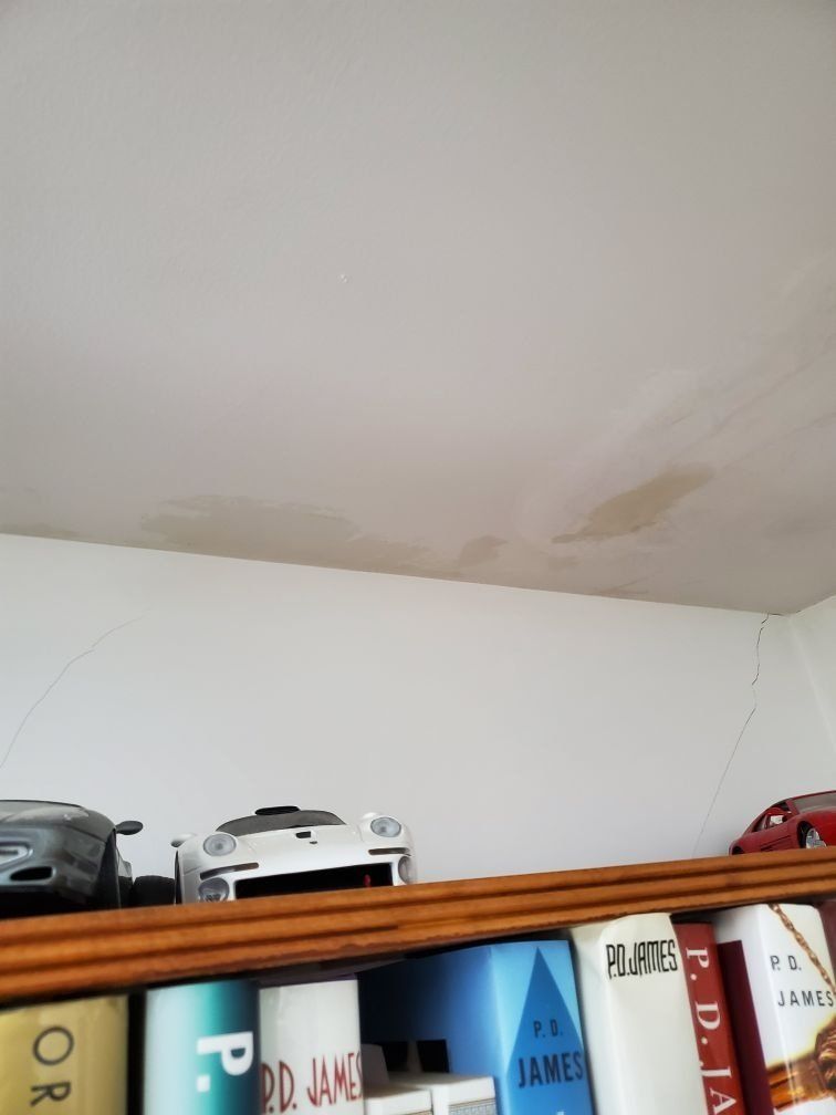 A ceiling that has been damaged by water.