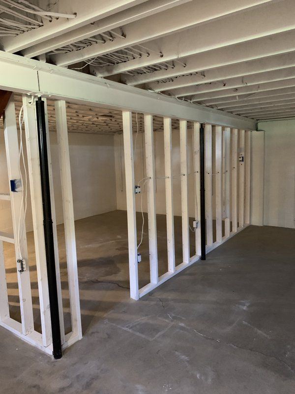 A room with a lot of wooden beams and a ceiling.