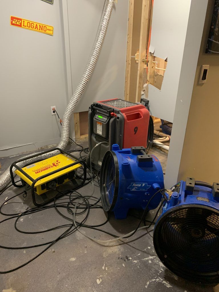 A room with a lot of electrical equipment on the floor.