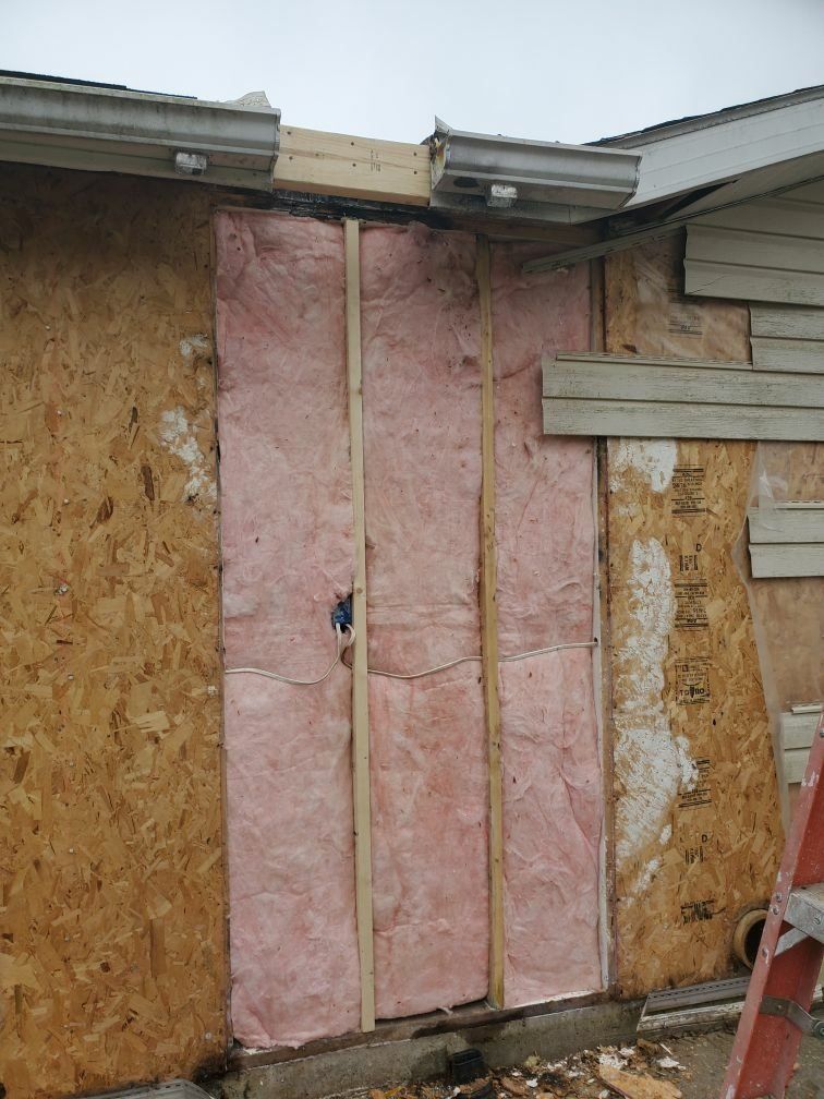 A house being repaired from chimney fire damage.