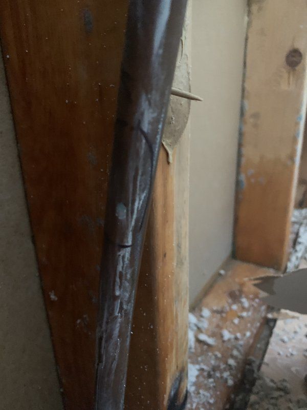 A close up of a piece of wood with a hole in it.