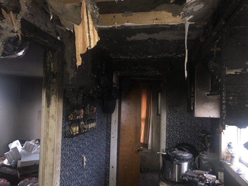 A kitchen that has been damaged by a fire.