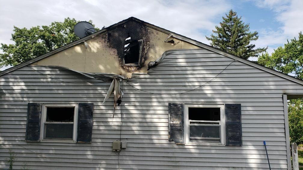 Exterior view of the kitchen fire damage on the roof of the house.