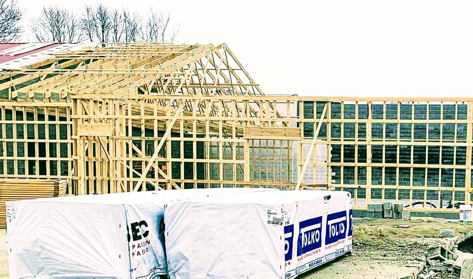 A building is being built with a lot of wood.