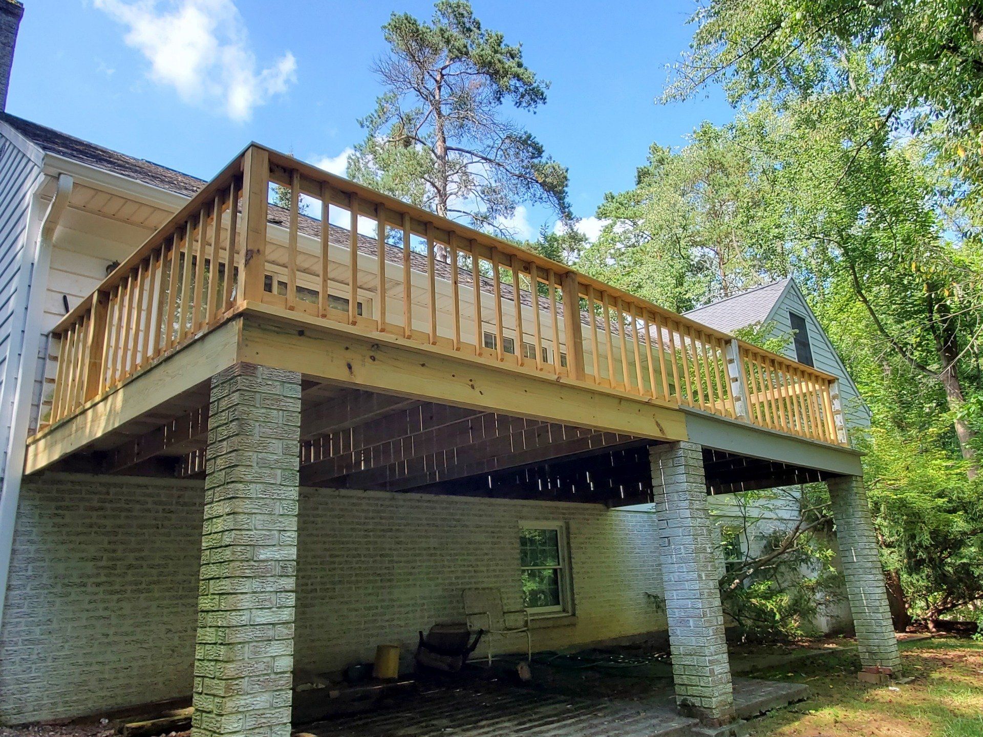 A house with a wooden deck.