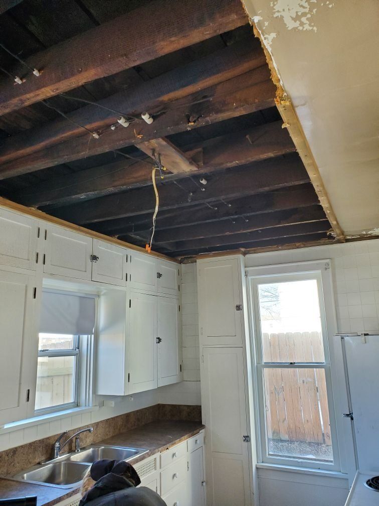 Half of the ceiling is removed to work on the water damage.
