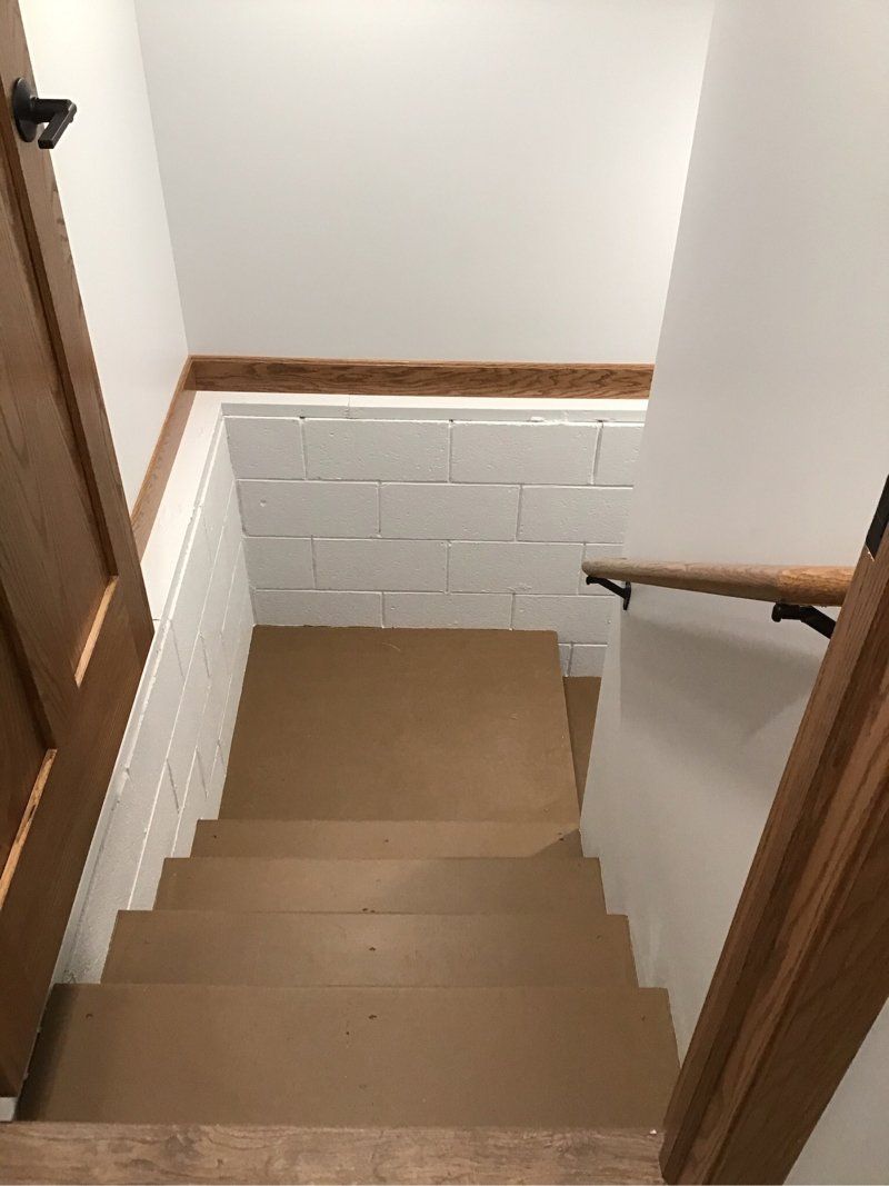 A set of stairs leading up to the second floor of a house.